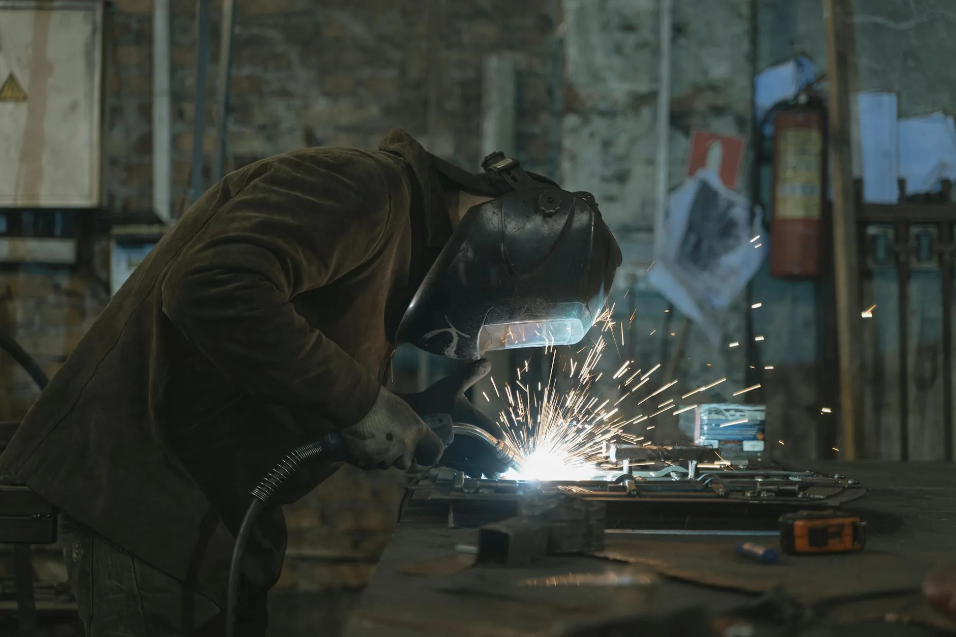 Industrial welding work on heavy equipment at the 704 Diesel shop